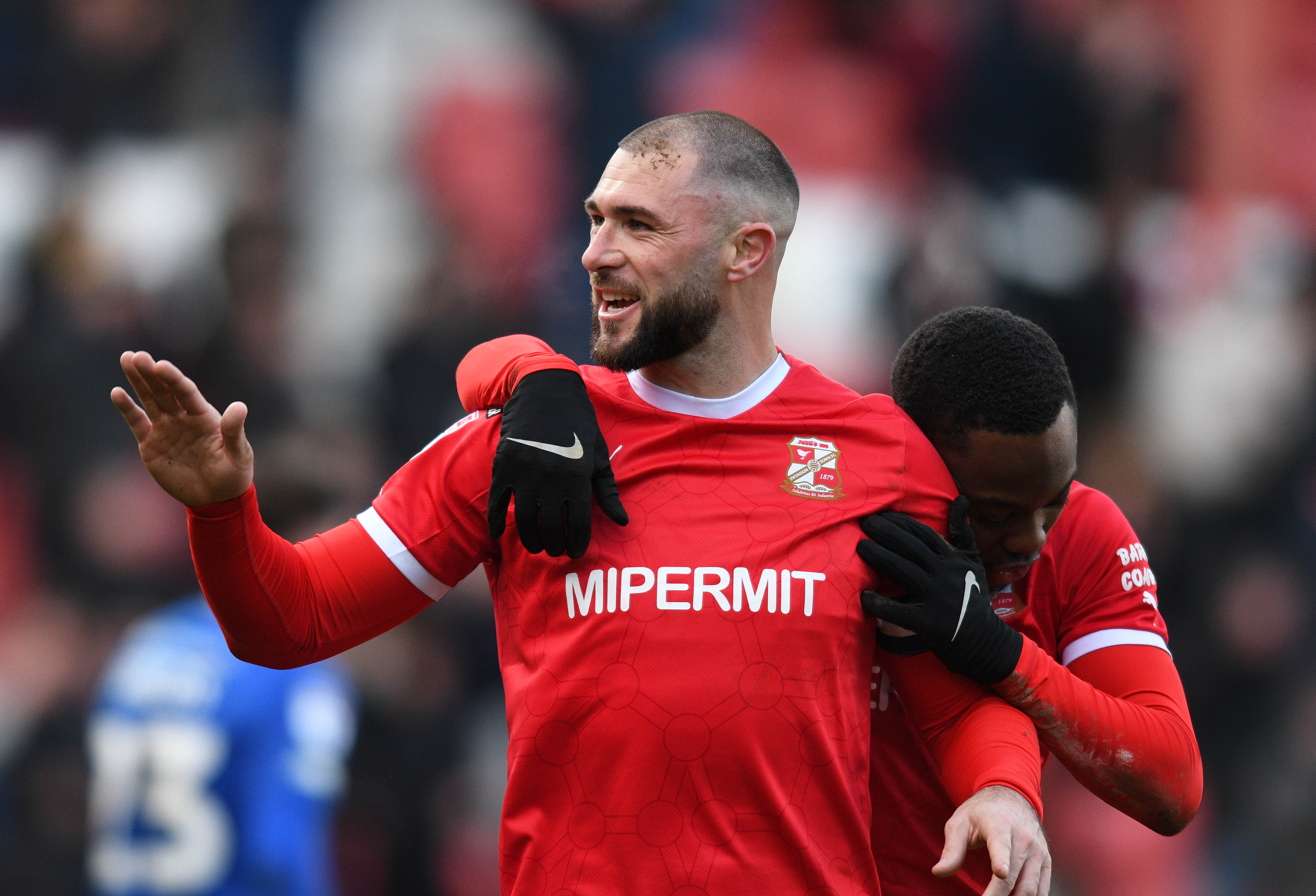 Austin not bothered about critics as his 199th goal earns Swindon a point