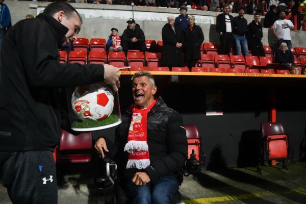 Health and safety firm’s donation scores for disabled Swindon Town fan