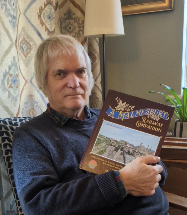 Mike Fenton with his book